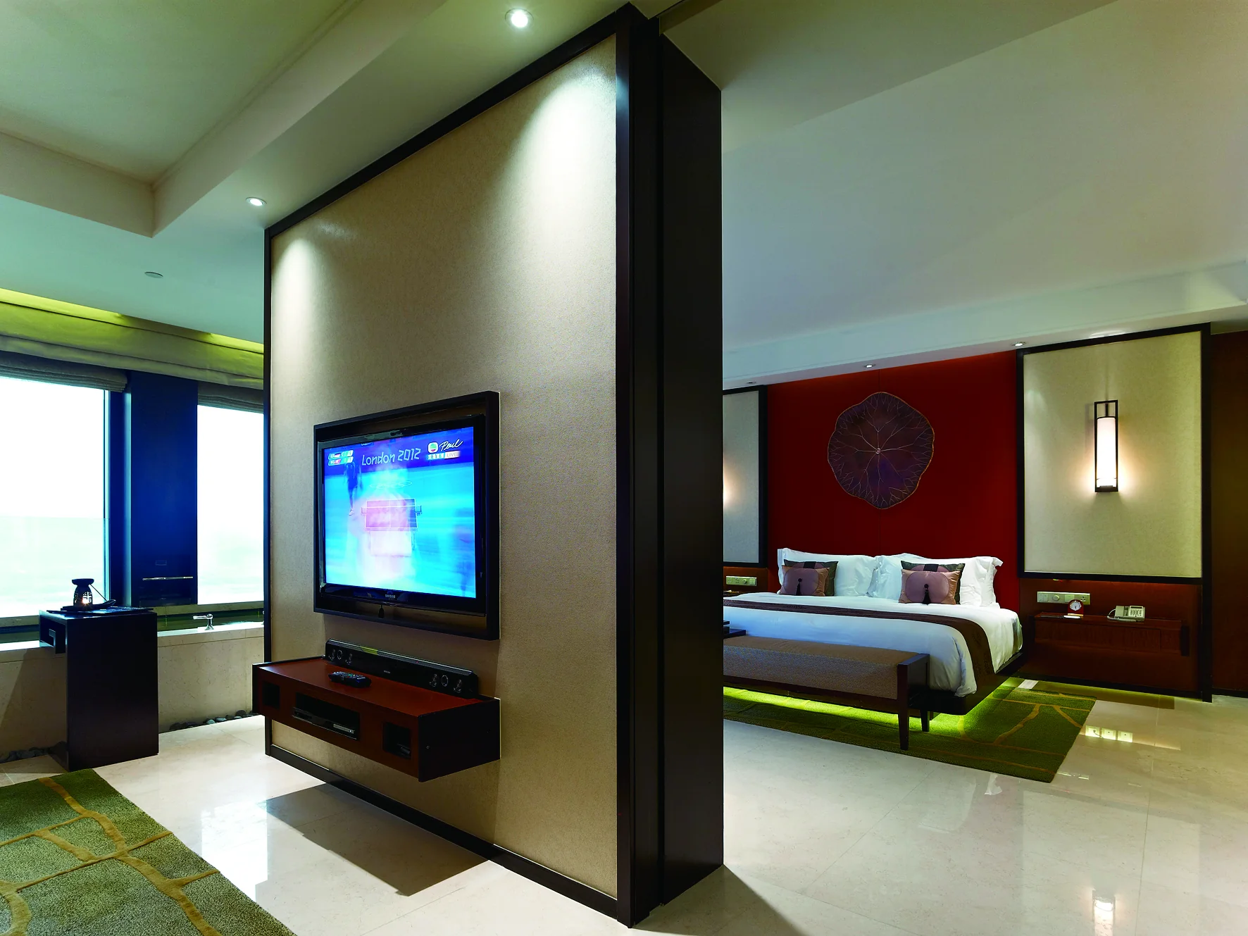 Banyan Tree Macau open-plan suite zoning and media casegoods