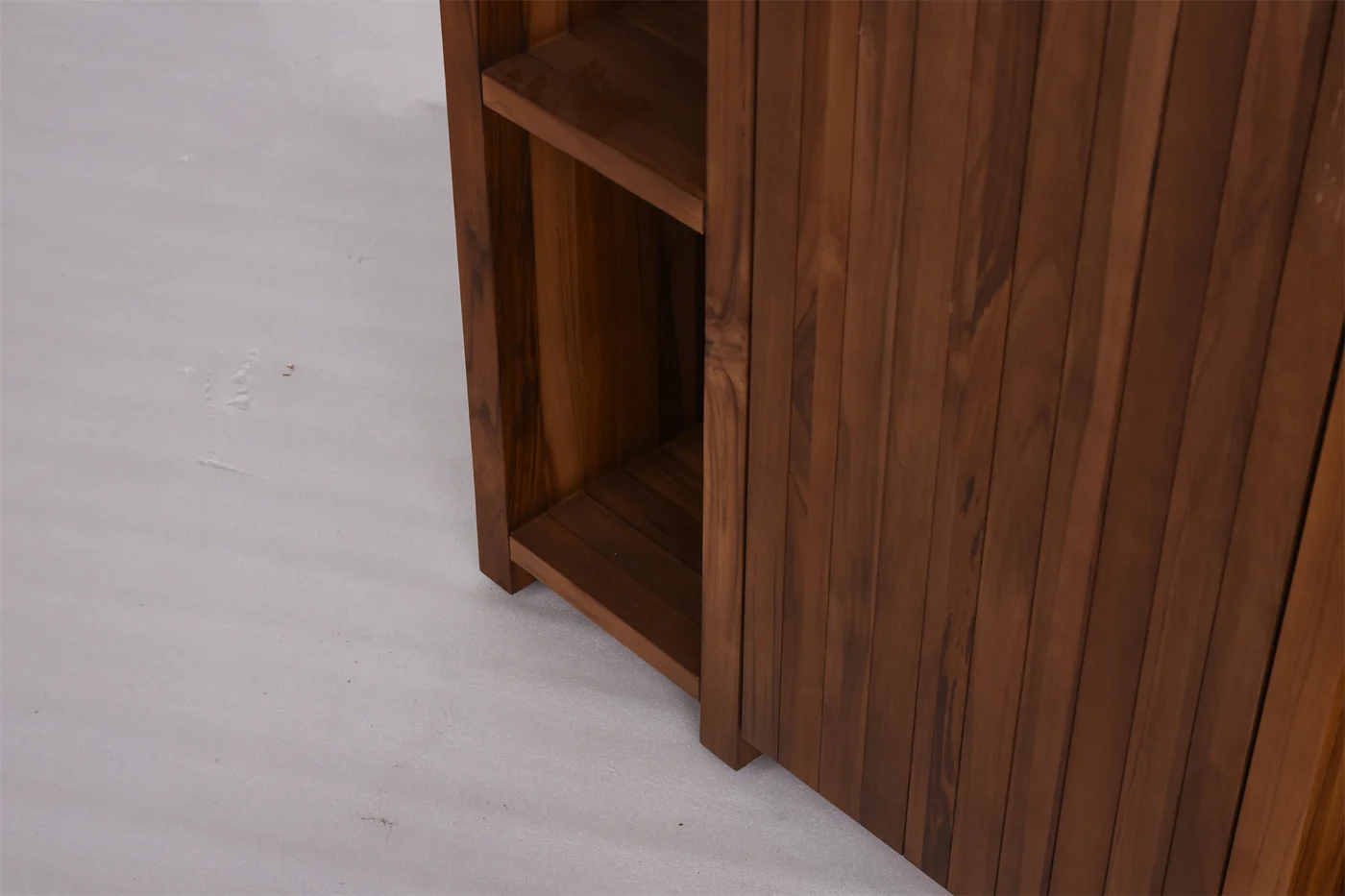 Wood-toned cabinet base with feet, shelves and vertical panel edges