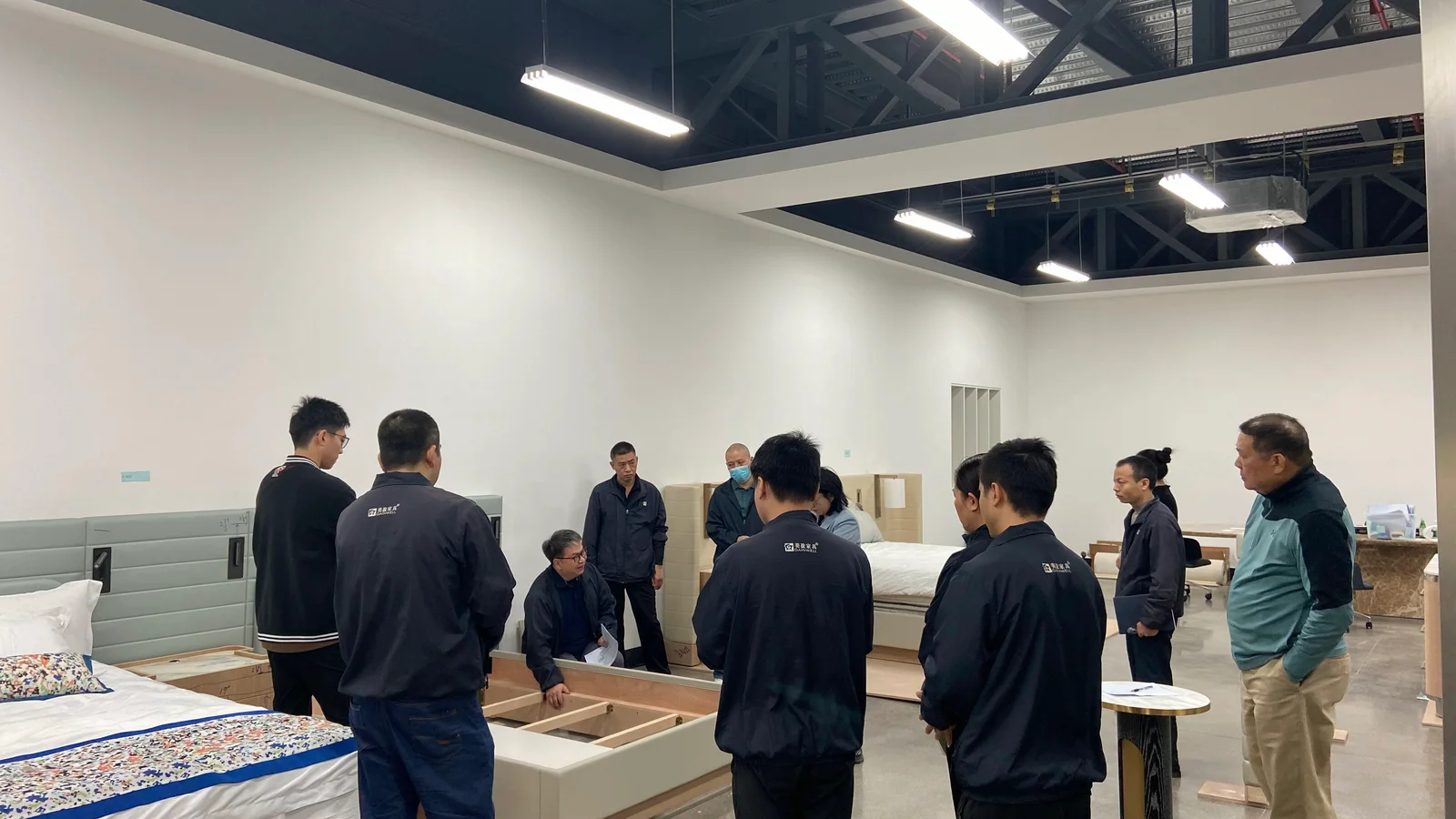 Gainwell team reviewing furniture in a full-scale mock-up room