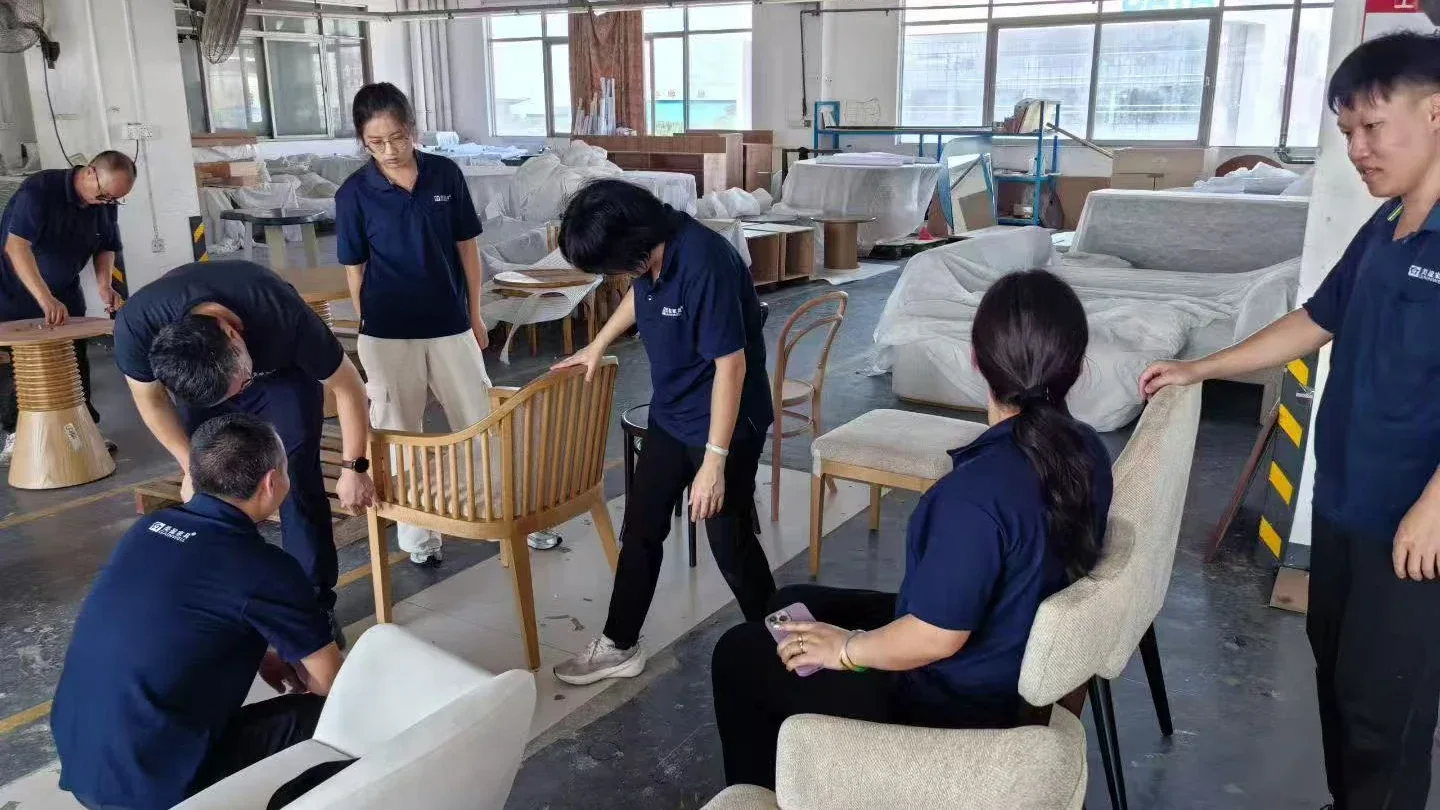 Gainwell staff checking custom chairs before packing
