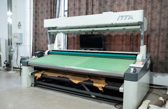 Fabric laid across a wide inspection machine