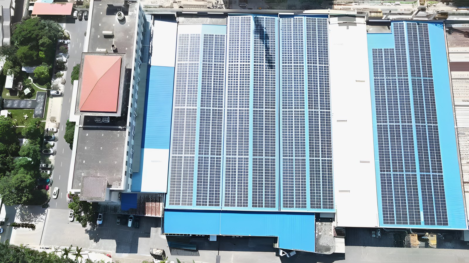 Aerial view of solar-panel arrays across Gainwell factory roofs