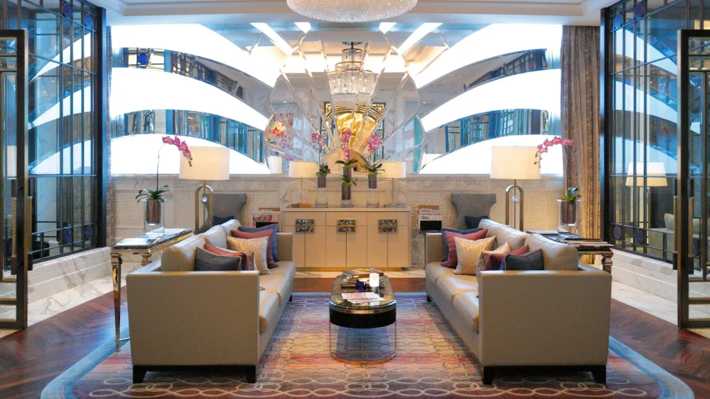 Hospitality lounge with sofas chairs tables and storage furniture