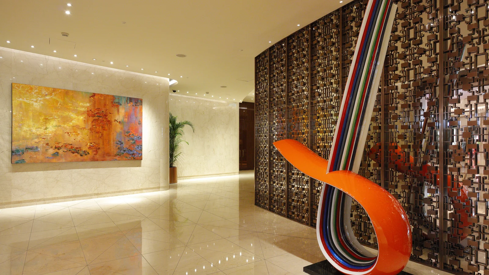 Hotel lobby threshold with decorative screen and clear passage
