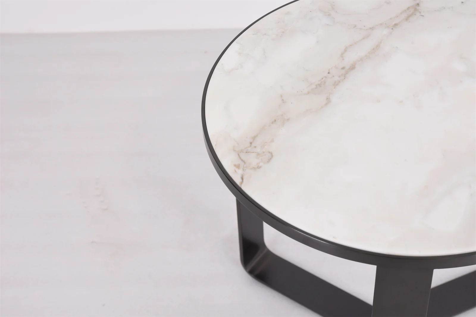Round patterned tabletop with a dark perimeter edge and base