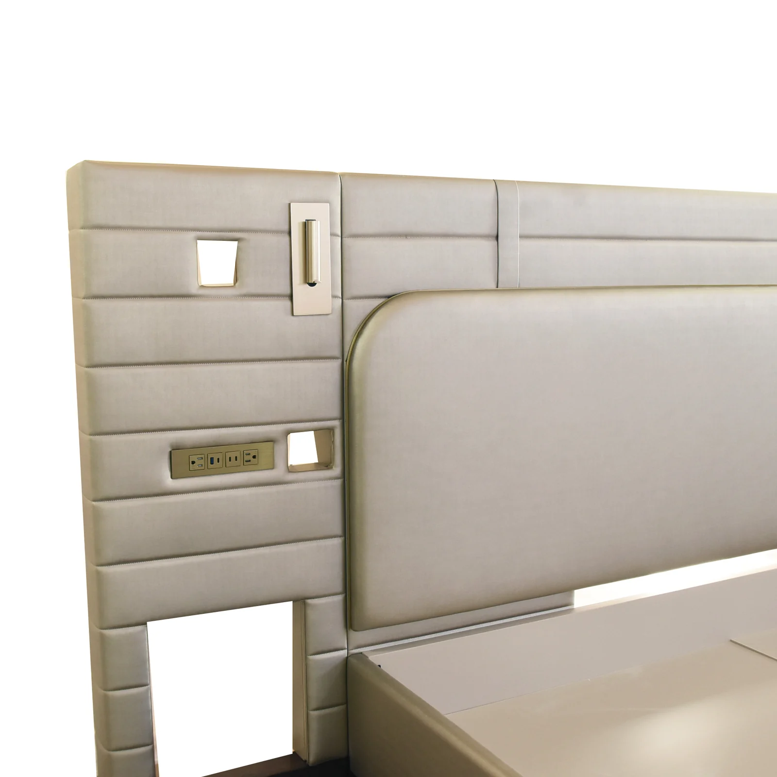 Close view of a hotel headboard with horizontal channels, central panel and service plates