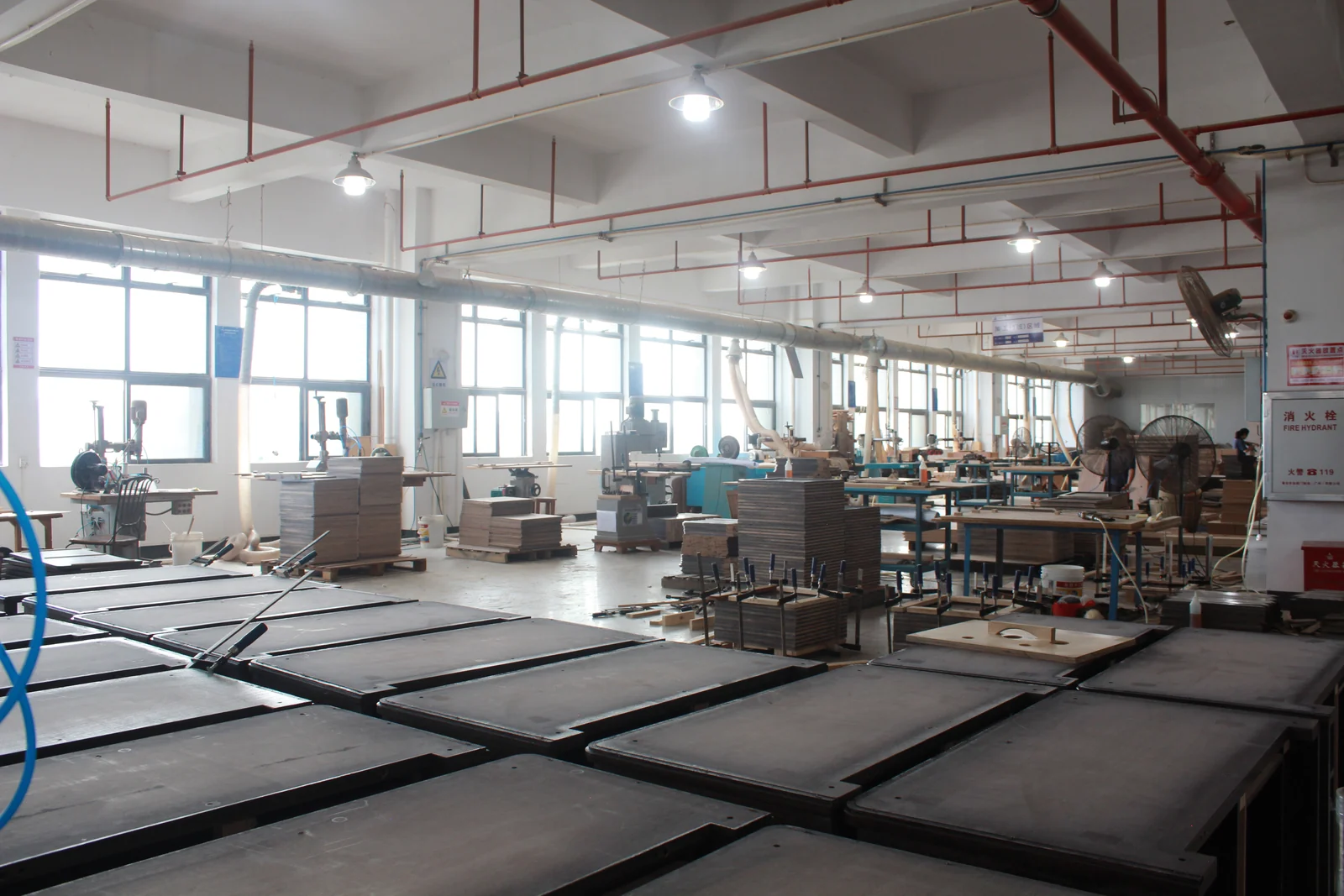 Furniture panels arranged in production batches inside a China workshop