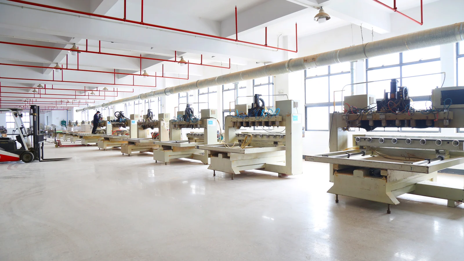 Hotel furniture production floor with machining equipment and workstations
