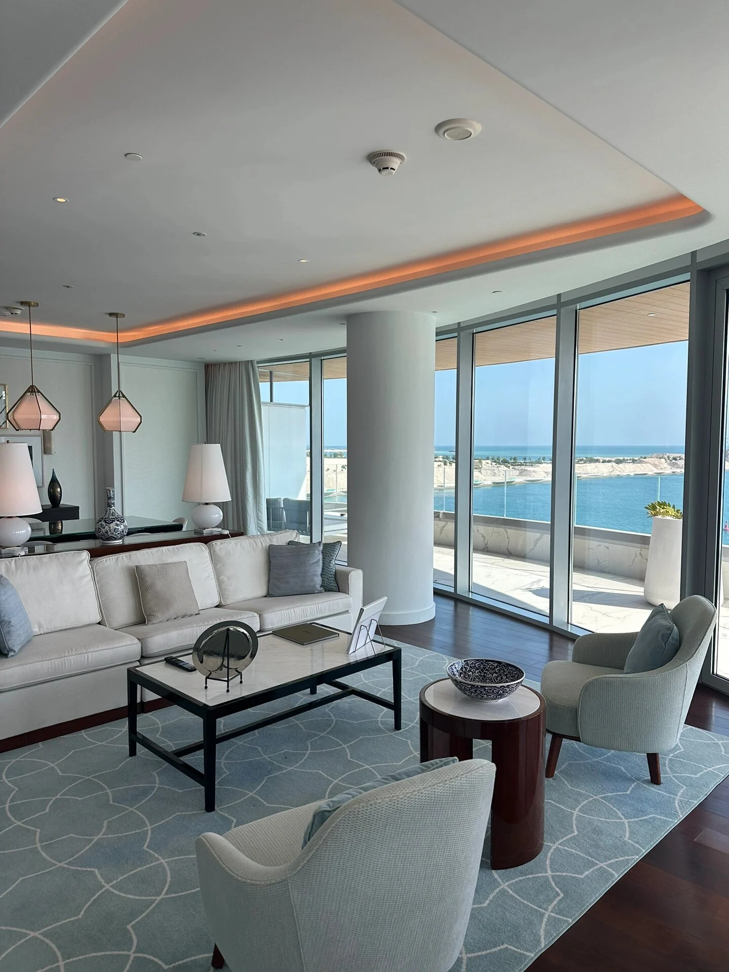 Hospitality lounge seating with square and round occasional tables