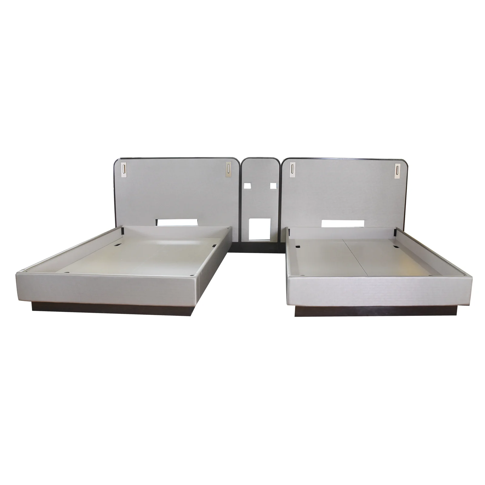 Two hotel bed platforms with separate rounded headboard panels and center service panel