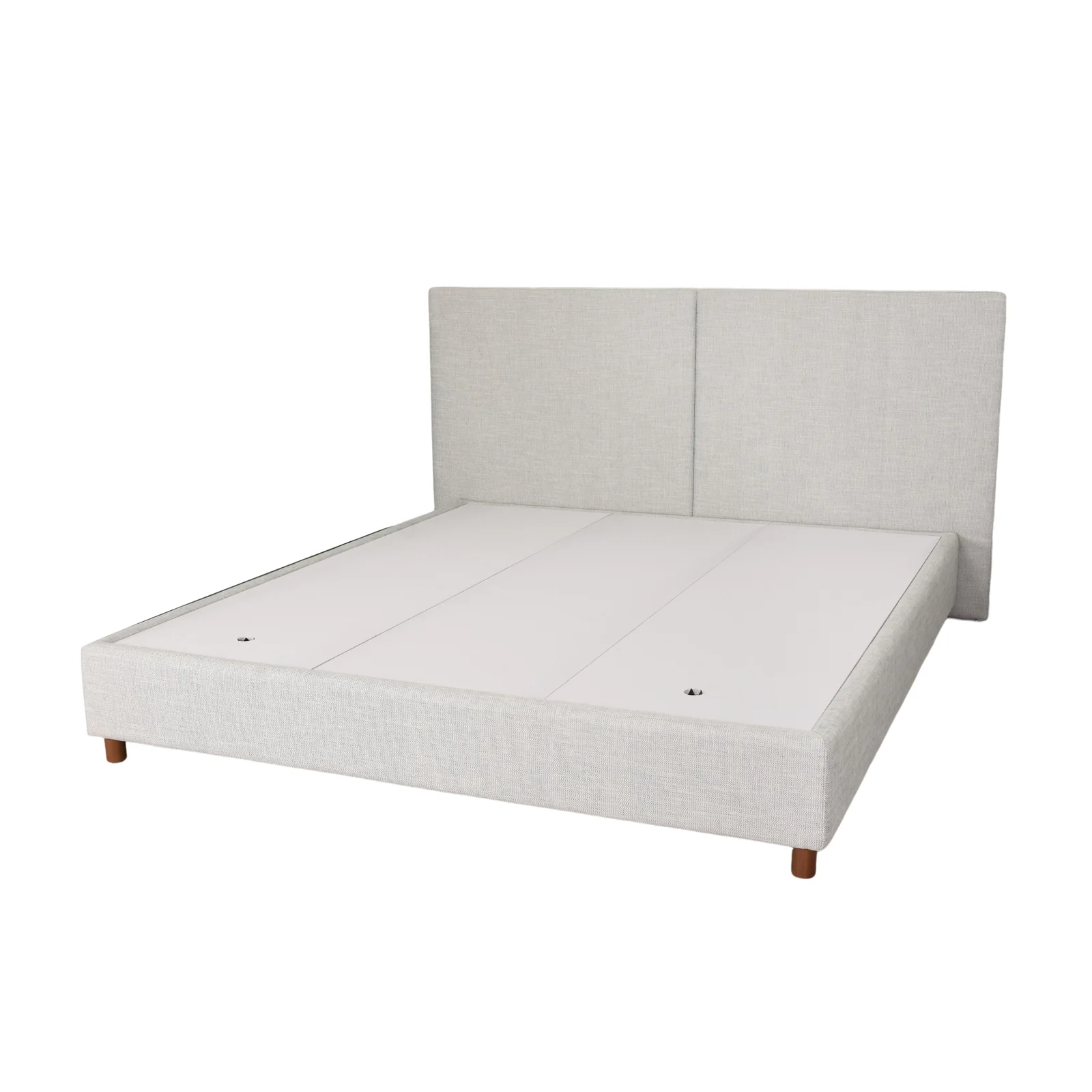 Upholstered bed platform positioned against a two-panel headboard