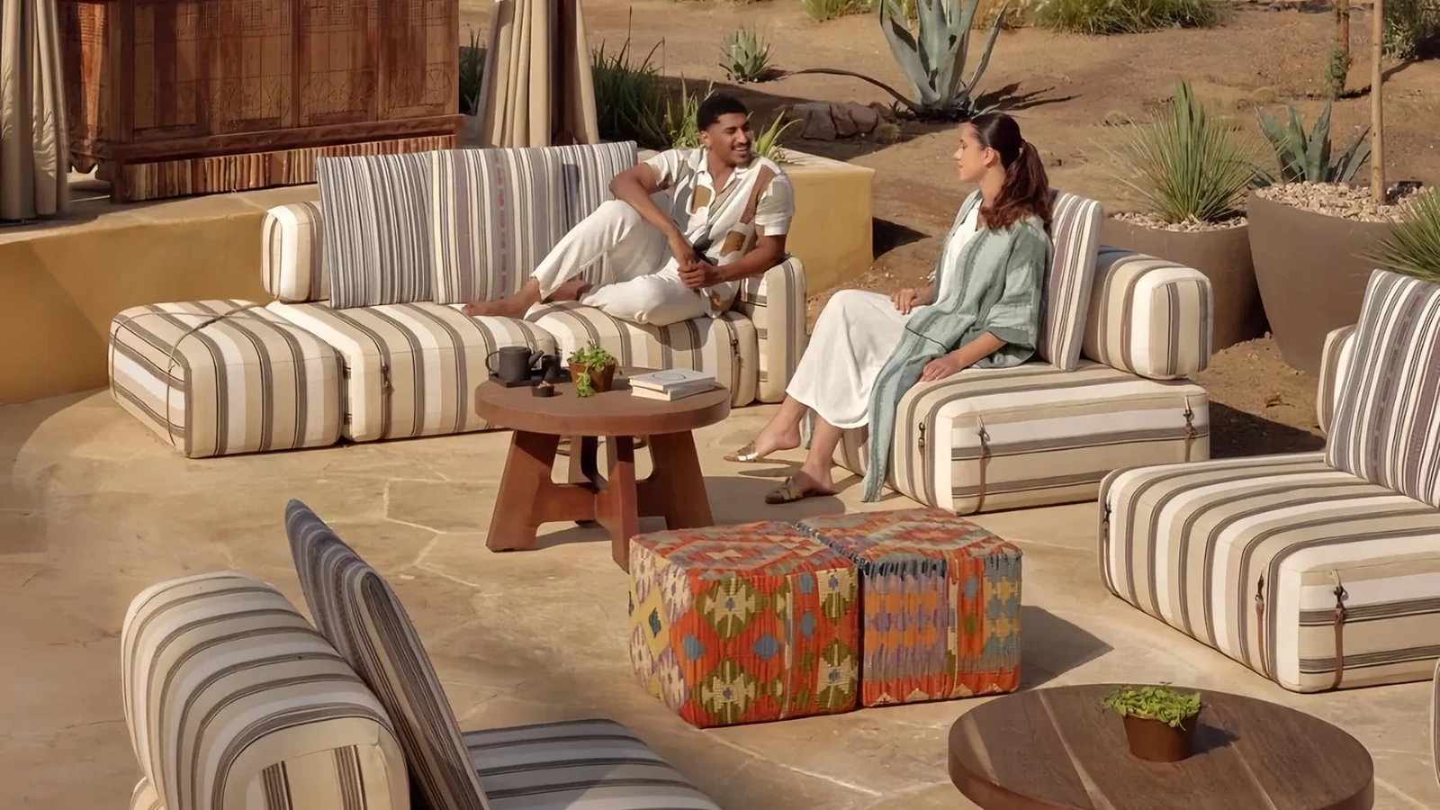 Cushioned lounge seating in a desert resort courtyard