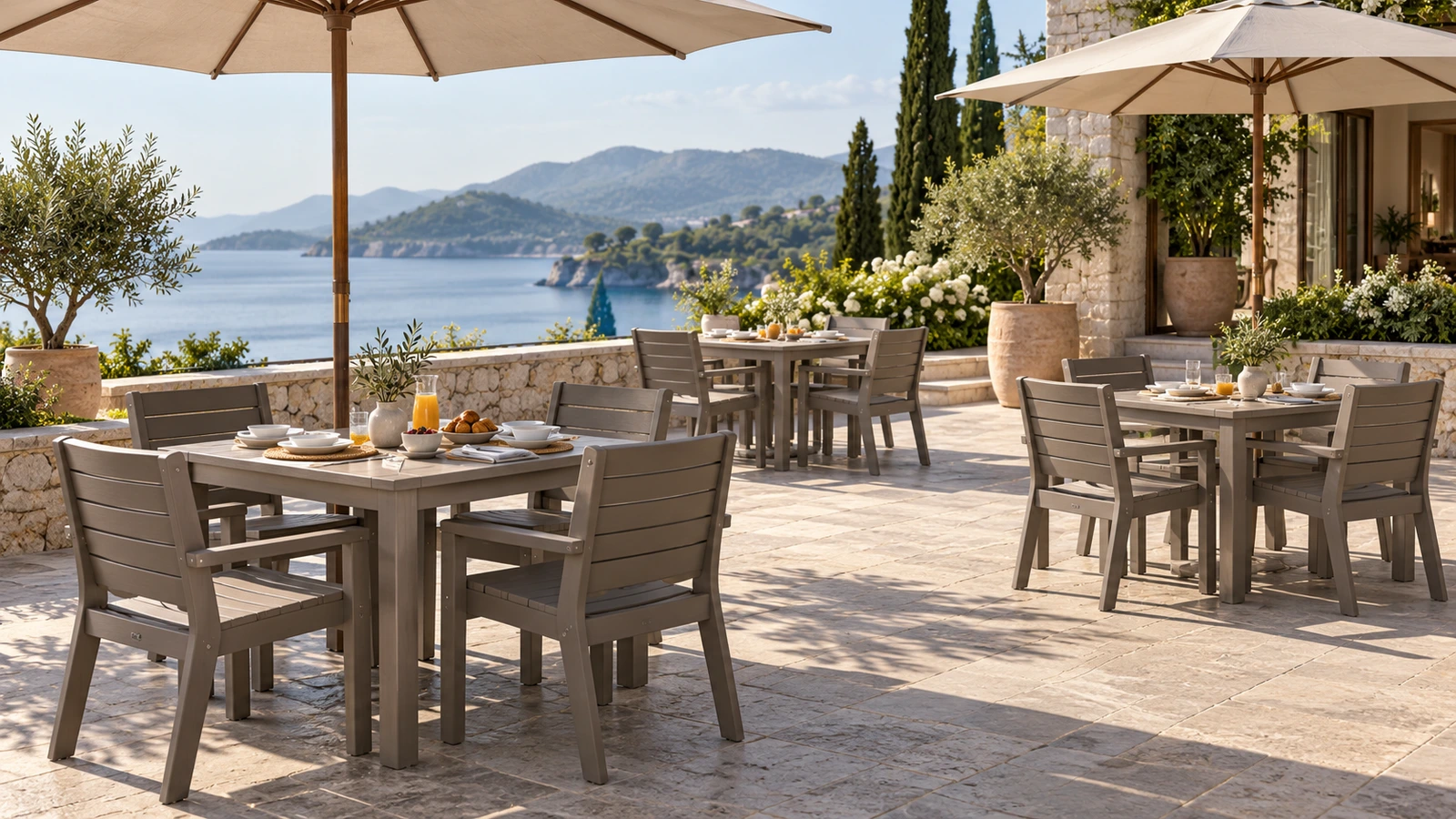 Outdoor dining groups arranged beneath parasols with space for circulation